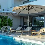 Luxury White Sails With A Multi Sport Court And Sea View